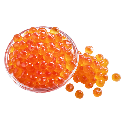 Clear glass bowl filled with orange caviar on a white background