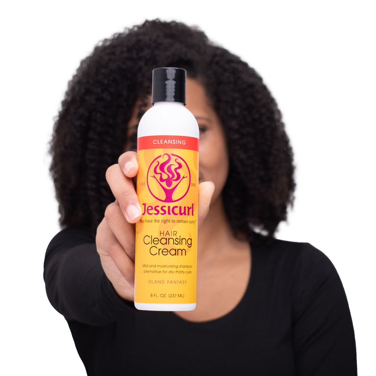 Person holding a bottle of Jessicurl Hair Cleansing Cream