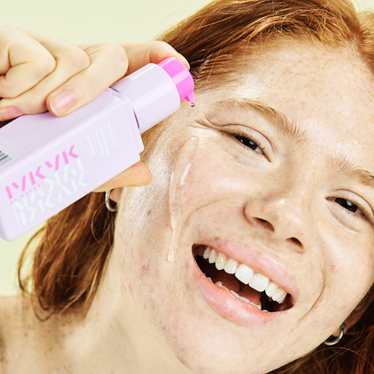 Person applying Makari IYKYK Probiotics Skin Barrier Protection Booster