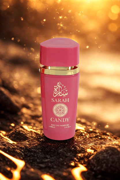 Sarah Candy Eau de Parfum on a textured surface with a warm glow.
